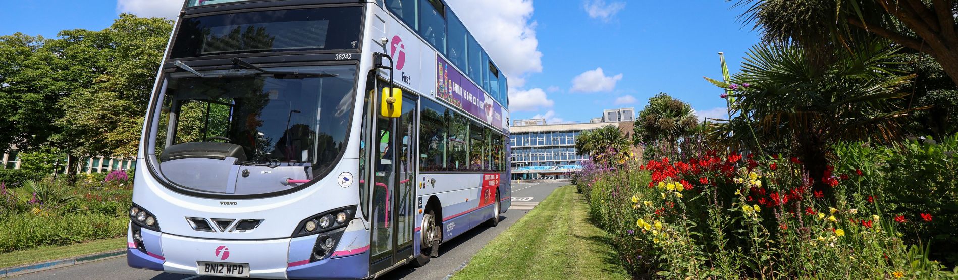 Image of a First Cymru bus driving down Fulton Lawn, Singleton Campus