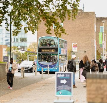 Image of a UniBus infront of Fulton House
