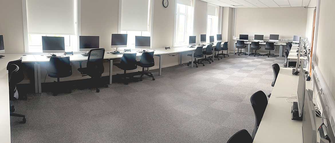 Pcs and chairs in a PC lab on Swansea University's Bay Campus